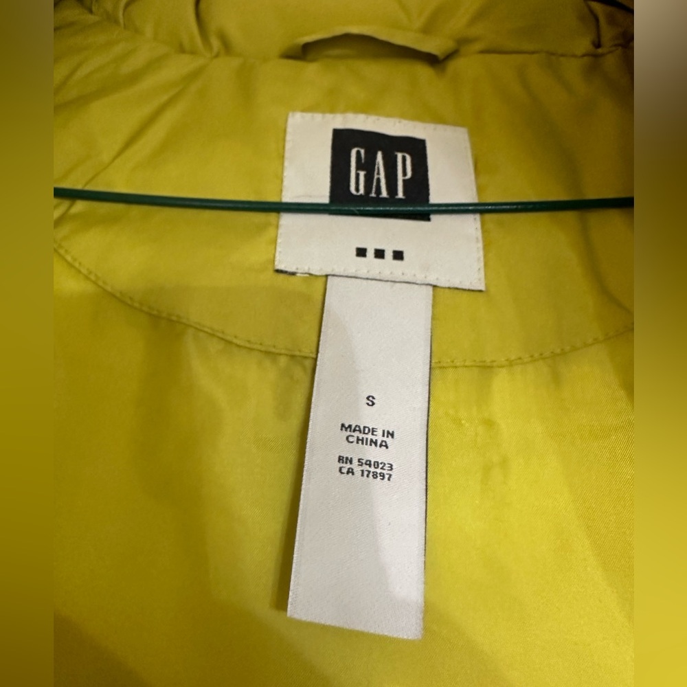 Women’s small lime green puffer vest from Gap. With removable fur hood.